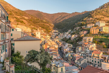 Wall Mural - sunset light in village valley at Riomaggiore, Italy