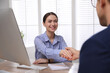 Man shaking hands with intern in office