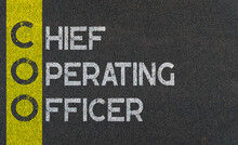 Chief Operating Officer (COO) Written Over Road Marking Yellow Paint Line. Acronyms And Abbreviations.