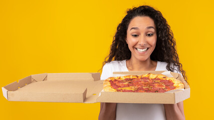 Wall Mural - Portrait Of Happy Lady Holding Looking At Pizza