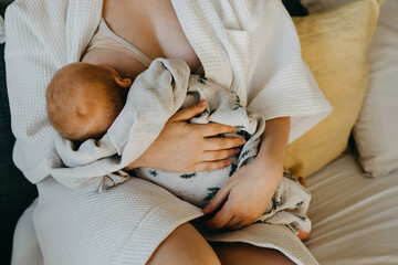 Wall Mural - Closeup of mother breastfeeding newborn baby.