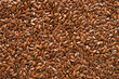 Linseed or flaxseed background, brown flax seeds. Flat lay, copy space