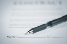 Close Up Of Pen On Docunent Contract Agreement Sign On Document Paper