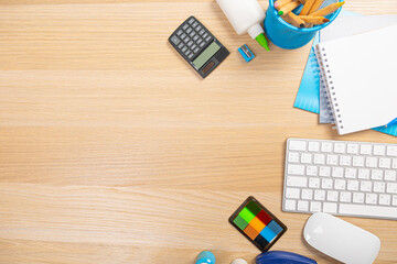 Wall Mural - View from above.Laptop,pen,tablet,smart phone and cup of coffee on white office desk with copy space.