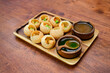 Panipuri In dian Food and wooden plate on Wooden Table