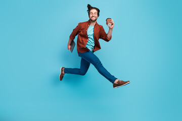 Sticker - Full body profile photo of cool brunet millennial guy run with laptop cup wear eyewear shirt pants shoes isolated on blue background