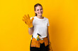 © luismolinero - Young electrician woman isolated on yellow background counting five with fingers