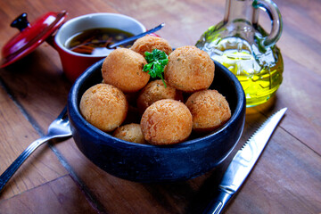 Wall Mural - Fried rice balls. Traditional from Brazil where it is called Bolinho de arroz.