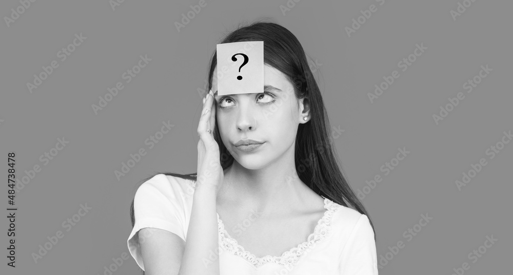 Paper notes with question marks. Doubtful girl asking questions to ...