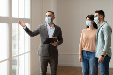 Sticker - Estate Agent In Facemask Showing Buyers New Apartment