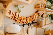 White Pumpkin And Bagels On A Rope. Organization Of Storage In The Kitchen