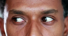 Extreme Close-up Of African American Man Eyes Looking Up , Down And Sideways