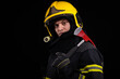© blanke1973 - Firefighter fully equipped with helmet and ax in smoke, black background