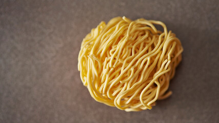 Poster - Dried homemade noodles on a gray background 