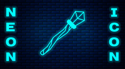 Poster - Glowing neon Magic staff icon isolated on brick wall background. Magic wand, scepter, stick, rod. Vector