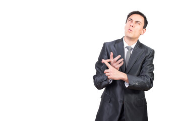 Pensive man in suit counting in studio