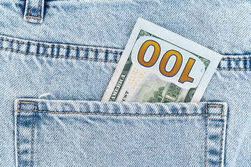 Wall Mural - banknotes in the pocket of blue jeans. cash turnover. one hundred dollar bill. 