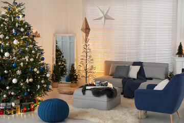 Sticker - Cozy living room interior with beautiful Christmas tree and comfortable furniture