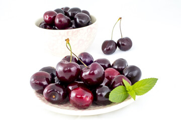 Wall Mural - Fresh cherries on a white background