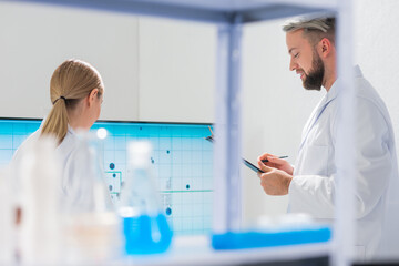Wall Mural - professional team of scientists is working on a vaccine in a modern scientific research laboratory. 