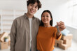 © Prostock-studio - Happy Asian couple showing house key at camera, moving to their own apartment, selective focus
