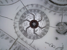 Aerial Top View Of The Architectural Elements Of The Mirror Labyrinth In The Regular Leisure Park In The City Of Krasnodar During The Winter Snowfall On A Cloudy Day