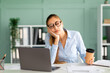 © Prostock-studio - Young businessman tired of computer work sleeping at workplace, holding coffee cup in hand