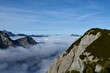 Mountain peaks in Julian alps and Karavanke mountains rising above the fog in Slovenia