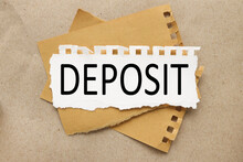 Deposit Word. Text On White Paper.on Brown Paper Background