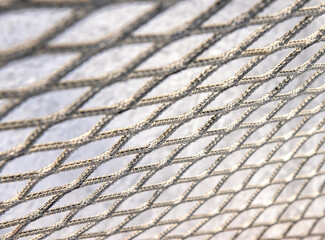 Closeup of hockey goal netting, 5mm knotless polypropylene reinforced twine, white background