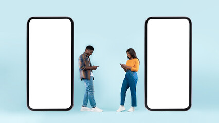 Wall Mural - Couple showing blank empty smartphone screen for mock up