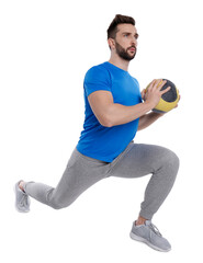 Poster - Athletic man doing exercise with medicine ball isolated on white