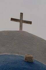 Wall Mural - A religious crucifix on the top of n orthodox church in Santorini Greece 