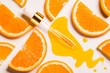 Vitamin C anti aging antioxidant beauty serum or oil drops and dropper on white background and slice of orange fruit natural organic cosmetic concept.