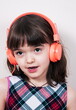 © gmstockstudio - Little girl using the earphones