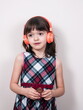 © gmstockstudio - Little girl using the earphones