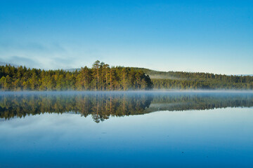 beautiful swedish lake in summertime with a blue sky