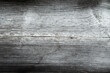 grunge background: sunburnt whitened wood surface close, cracks and dents, toning