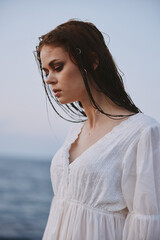 Wall Mural - Attractive woman in white dress at the sea beach freedom