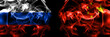 Russia, Russian vs China, Chinese flags. Smoke flag placed side by side isolated on black background