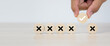 Hand choose check mark on wooden toy stack with cross symbol for true or false changing mindset or way of adapting to change leader and transform quiz answer and poll concept