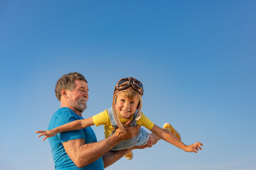 Grandfather and boy having fun outdoor