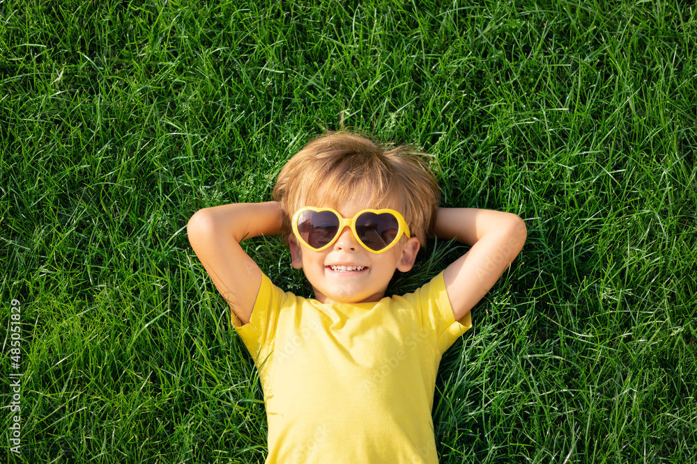 Playing Outside In Spring Foto Happy child playing outdoor in spring park do Stock | Adobe Stock