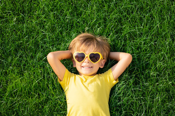 happy child playing outdoor in spring park