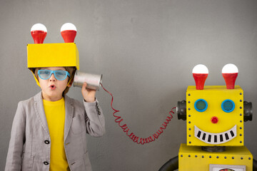 Poster - Happy child playing with robot