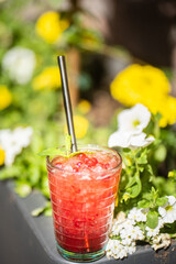 Canvas Print - A vertical shot of a cranberry drink in a cafe