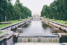 Grand Palace, Cascade And  Channel Of Peterhof Palace In Saint Petersburg, Russia.