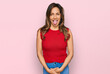 Young hispanic woman wearing casual clothes sticking tongue out happy with funny expression. emotion concept.