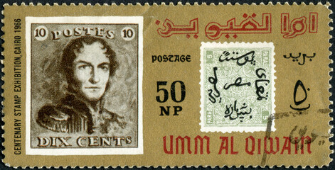 Wall Mural - UMM AL QIWAIN - CIRCA 1966: A stamp printed in United Arab Emirates devoted to the philately exhibition in Cairo