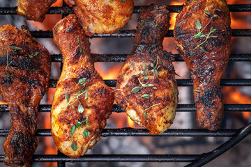 Wall Mural - Hot roasted chicken leg with spicy spices and herbs.